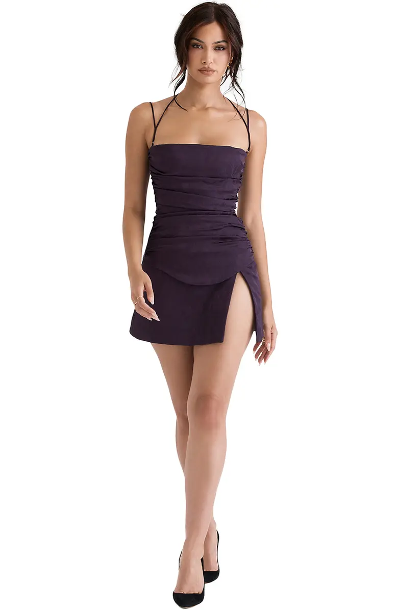 Model with black hair wearing a purple nightshade Melia Floral Jacquard Stretch Satin Minidress with a gathered bodice and a lace-up back by House of CB.